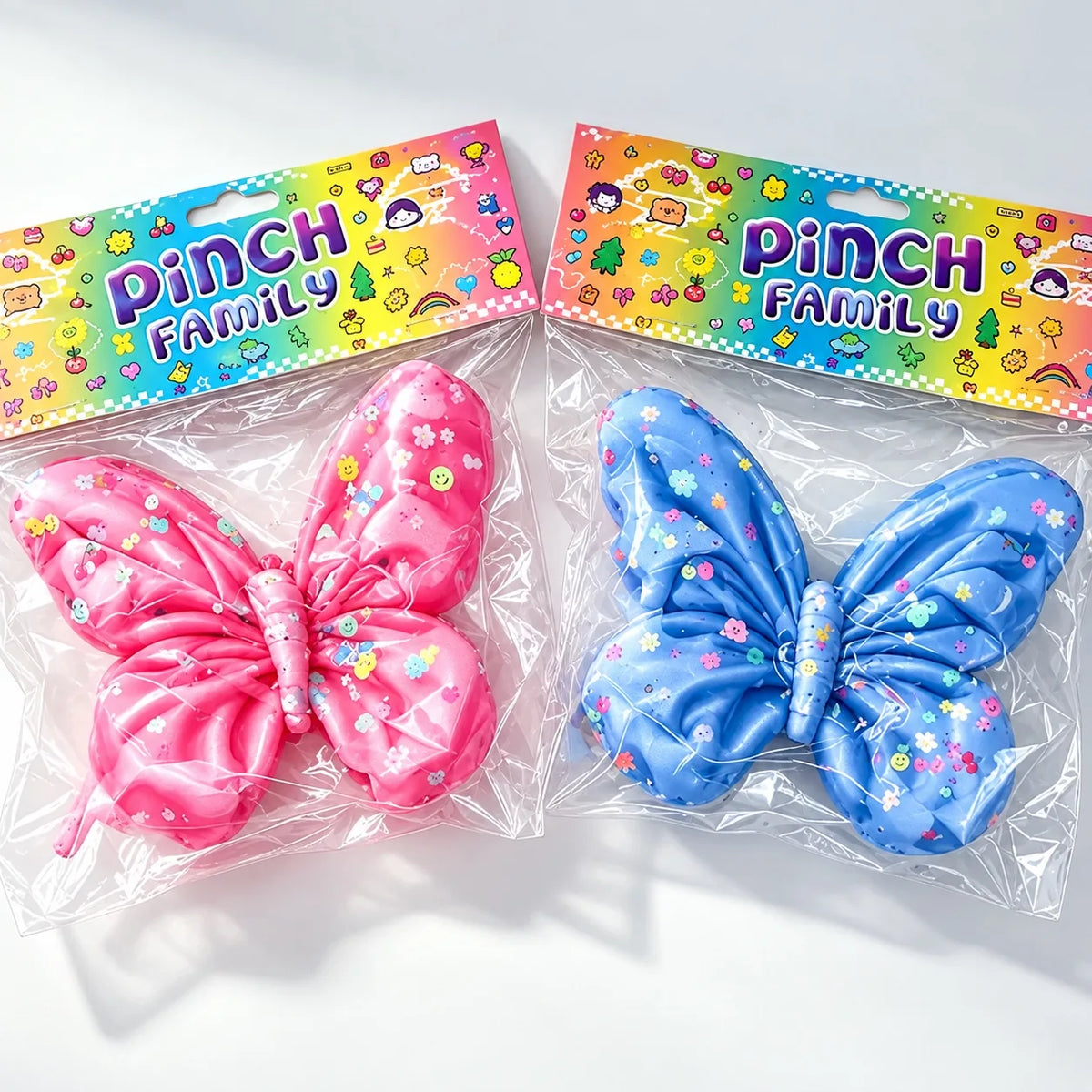 Cute pink and blue butterfly squishy toys with colourful floral and smiley prints
