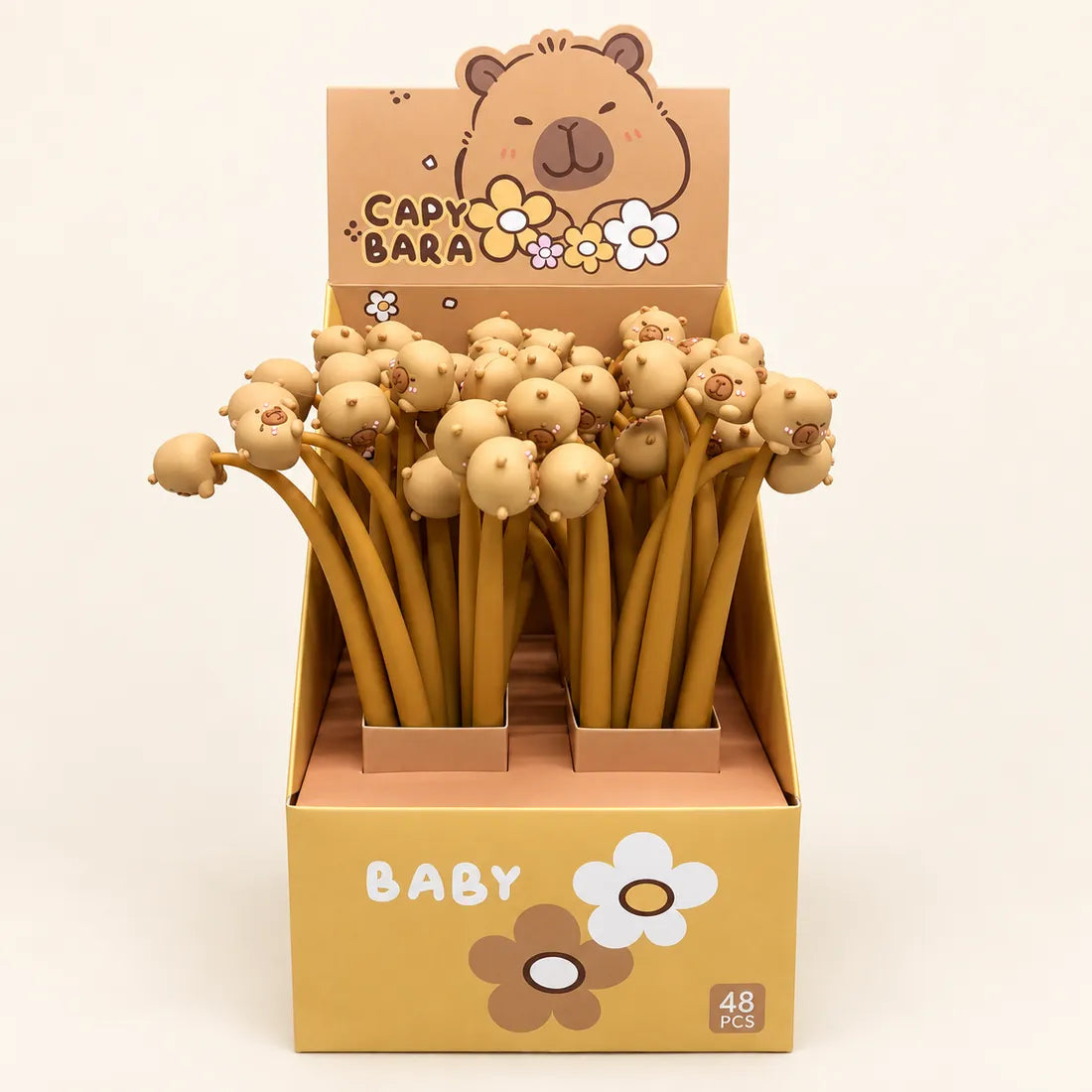 Yellow capybara pens in a floral display box.