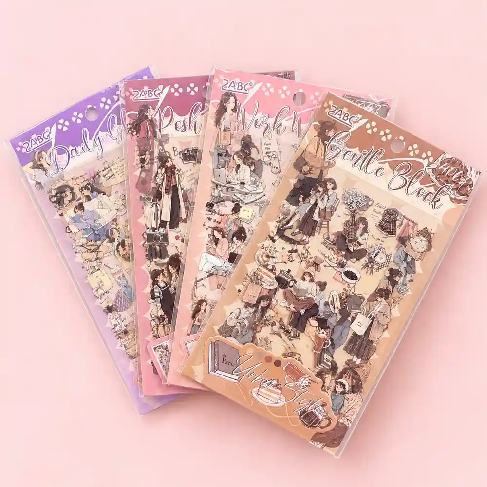 Four decorative sticker sheets fanned out on a light pink background. The sheets feature vintage-style illustrated characters and text including 'Only You', 'Posh', 'Work', and 'Gentle Block', with pastel color schemes in purple, pink, and beige.