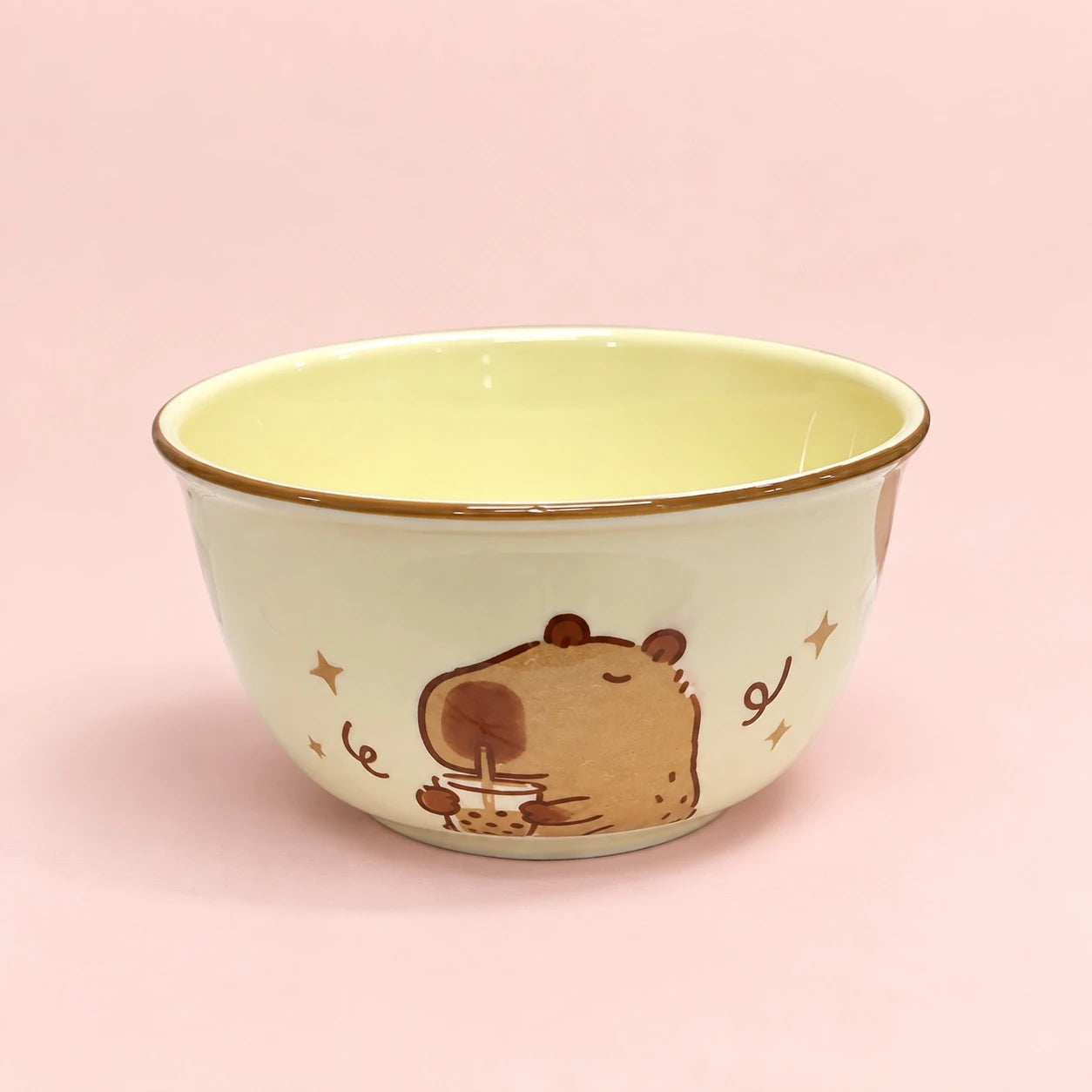 Cream and yellow capybara ceramic bowl with cute boba design on pastel pink background