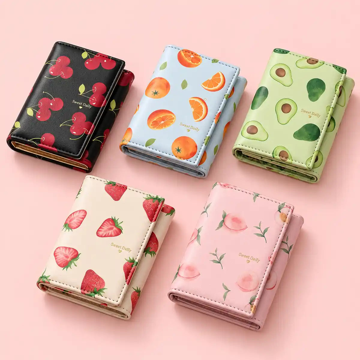 Cute fruit print mini wallets in strawberry, cherry, orange, avocado and peach designs.