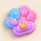 Pastel blue pink and purple paw-shaped squishy toy with colourful floral details and candy charm