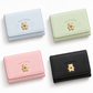 Cute Korean style mini wallet with teddy bear design, card slots, and ID holder, available in pastel blue, green, pink, and black.