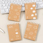 Mini Kitty Spiral Notebook with cute white cat prints and kraft-style cover