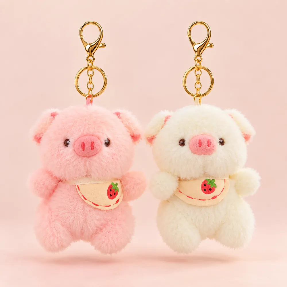 File Name: strawberry-piggy-plush-keychain-pink-cream.webp

Alt Text: Pink and cream strawberry piggy plush keychains with soft fluffy texture and cute strawberry bib design.