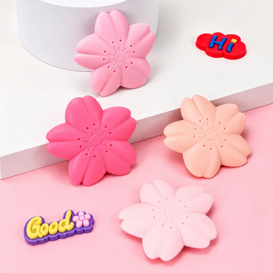 Sakura flower-shaped kawaii eraser in assorted soft pink and peach pastel colours