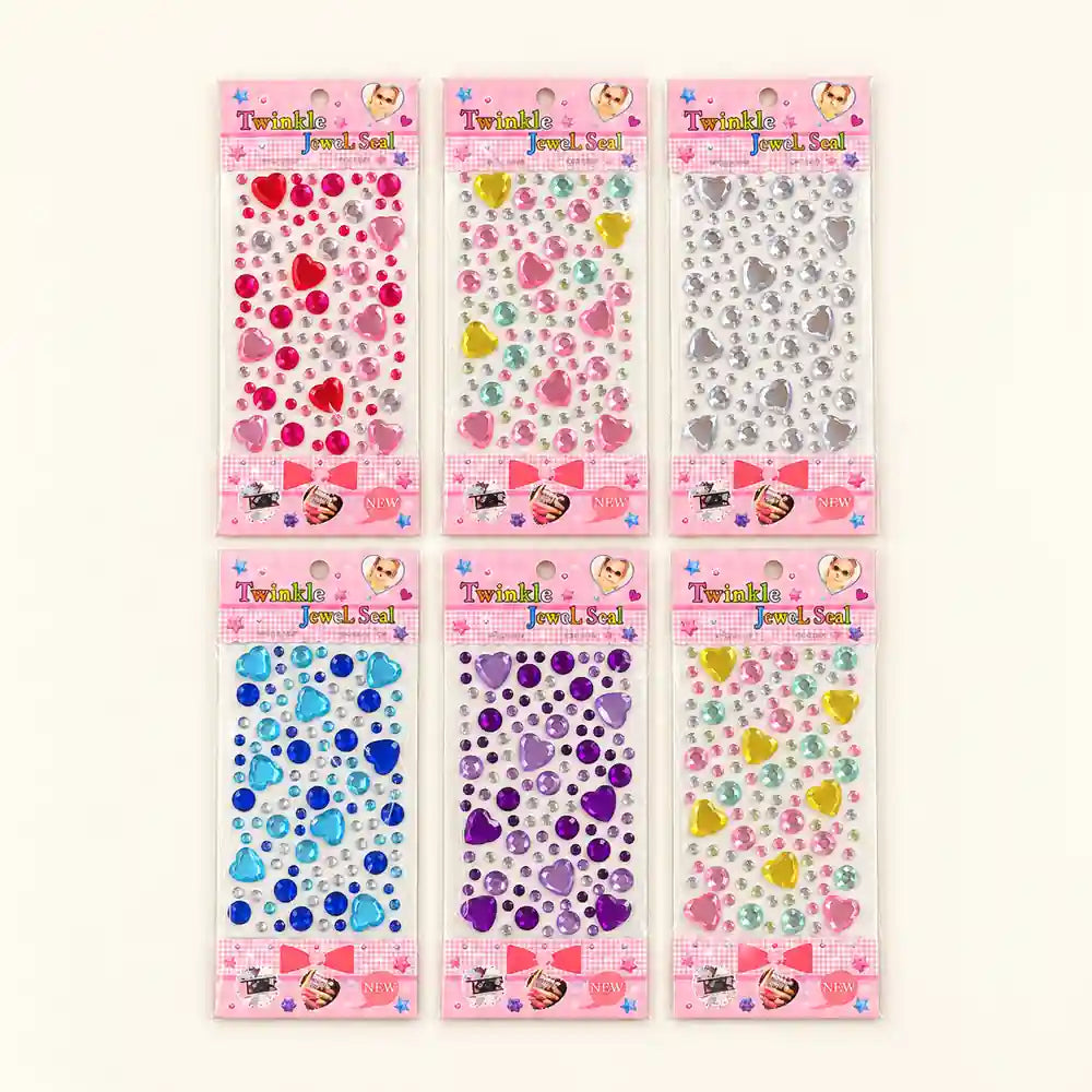 Six packages of Twinkly Jewels Gel Stickers arranged in a 2x3 grid on a light cream background. The packages contain assorted heart-shaped and round jewel stickers in various colors including red, pink, yellow, blue, purple, and silver.